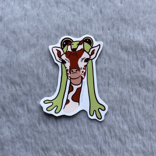 giraffe with frog hat